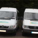 Two of our mini buses parked up